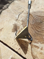 Classic Hoe Hand Forged Garden Tool laying on side with sharp tool head. 