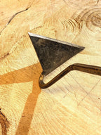 Dutch Weeder, Right or Left Handed by Homestead Iron highlighting head with kids drawing on wood in background.