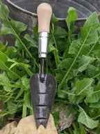 Multi-Purpose Trowel, Hand Forged Garden Tool by Homestead Iron with chicory leaf background on stone