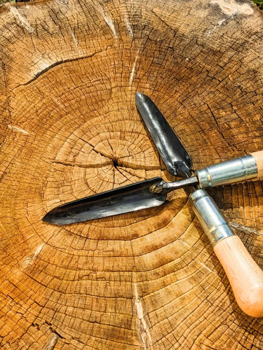 Sharp Shooter Trowel Homestead Iron two tools crossed.