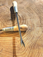 Weeding Fork (dandelion fork) Hand Forged Garden Tool Homestead Iron on wooden background point sharp out