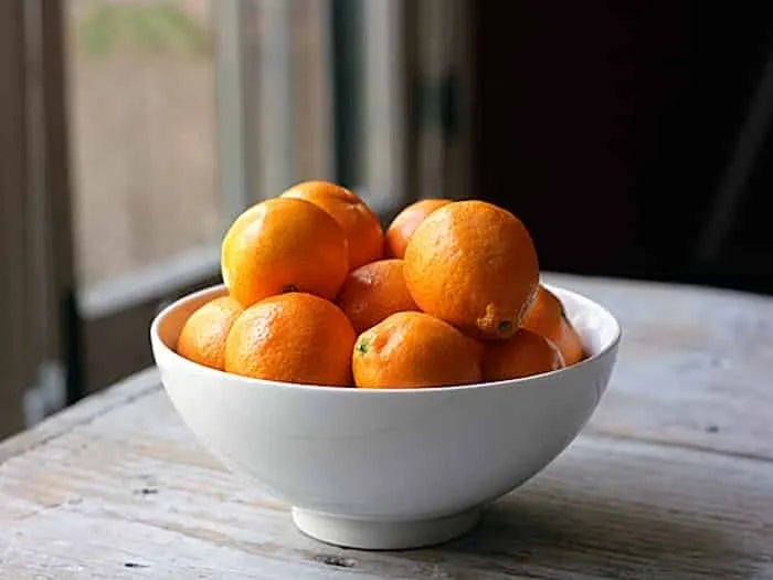 Bowl of tangerines by Missouri Herbs. 